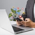 Man using laptop for live chat, social media, digital and online marketing in Cyprus