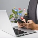 Man using laptop for live chat, social media, digital and online marketing in Cyprus